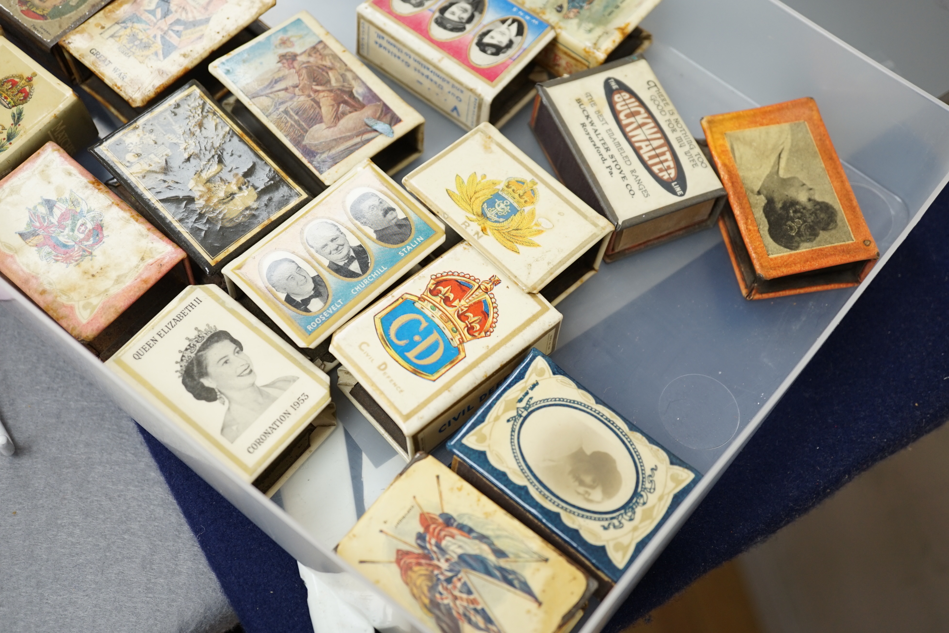 A collection of early and mid 20th century WWII match box holders